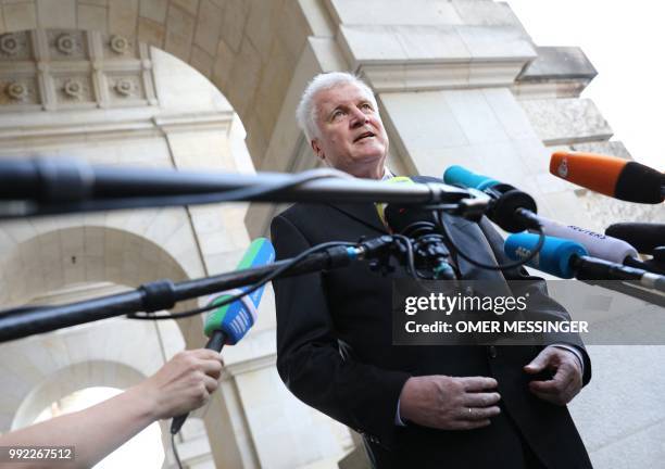 German Interior Minister and Bavarian Christian Social Union politician Horst Seehofer delivers a statement ahead of a meeting of the coalition...