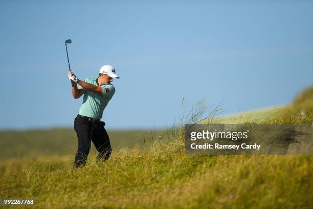 Donegal , Ireland - 5 July 2018; Paul Dunne of Ireland plays from the rough on the 18th hole during the Day One of the Irish Open Golf Championship...