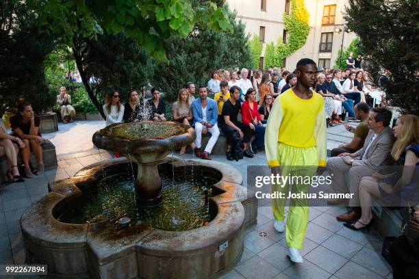 Model walks the runway at the Marcel Ostertag show during the Berlin Fashion Week Spring/Summer 2019 at Westin Grand Hotel on July 4, 2018 in Berlin,...