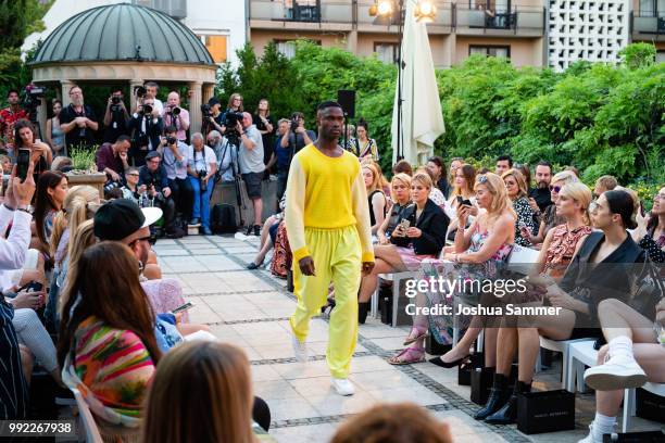 Model walks the runway at the Marcel Ostertag show during the Berlin Fashion Week Spring/Summer 2019 at Westin Grand Hotel on July 4, 2018 in Berlin,...