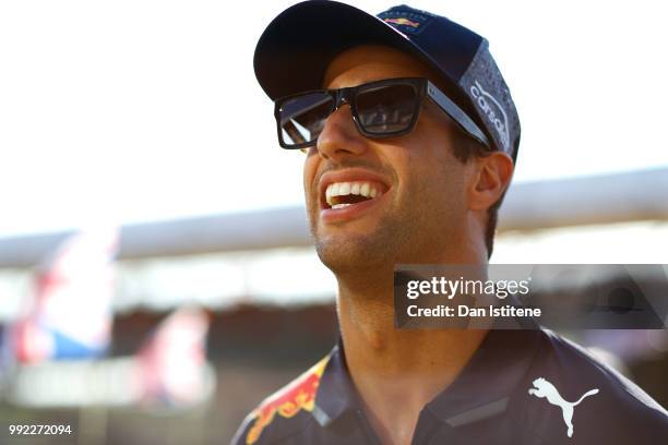 Daniel Ricciardo of Australia and Red Bull Racing smiles during previews ahead of the Formula One Grand Prix of Great Britain at Silverstone on July...