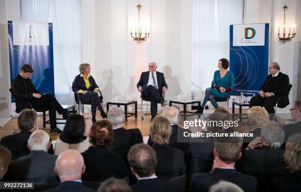 German President Frank-Walter Steinmeier and writers Daniel Kehlmann , Eva Menasse and Salman Rushdie sit together with moderator Luzia Braun during...