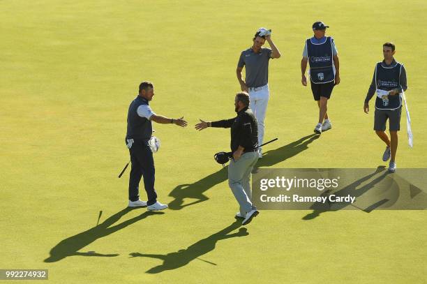 Donegal , Ireland - 5 July 2018; Lee Westwood of England shakes hands with Shane Lowry of Ireland on the 18th hole during Day One of the Irish Open...