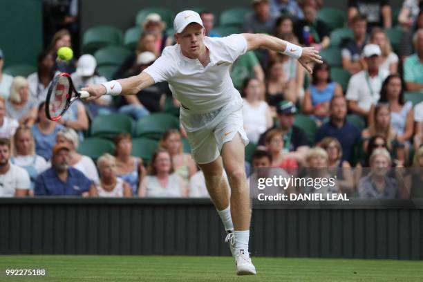 Britain's Kyle Edmund returns to US player Bradley Klahn in their men's singles second round match on the fourth day of the 2018 Wimbledon...