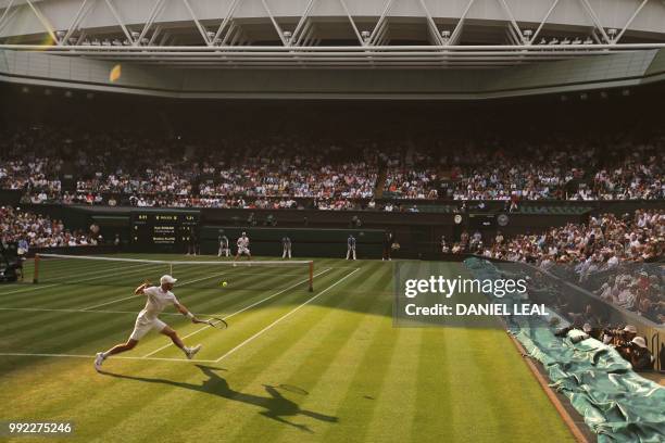 Player Bradley Klahn returns to Britain's Kyle Edmund in their men's singles second round match on the fourth day of the 2018 Wimbledon Championships...