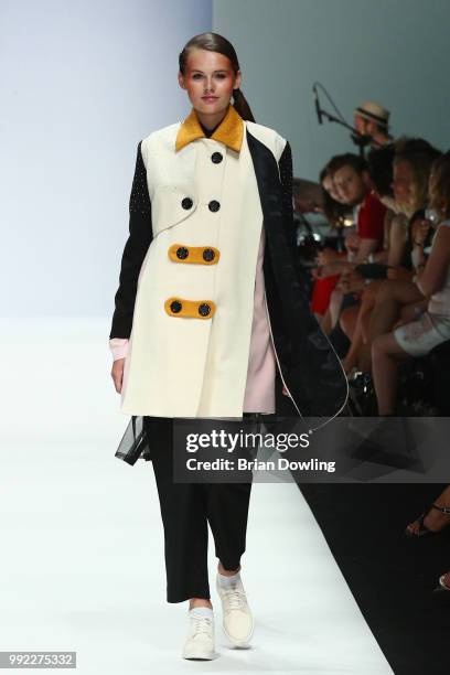 Wearing the collection of Andrea Bou, a model walks the runway at the Rebelpin - Fashion Awards By Acte show during the Berlin Fashion Week...