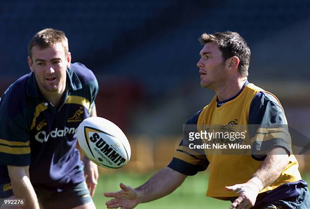 Daniel Herbert of Australia passes the ball during the Wallabies last training session at Subiaco Oval ahead of Saturday nights Tri Nations Rugby...