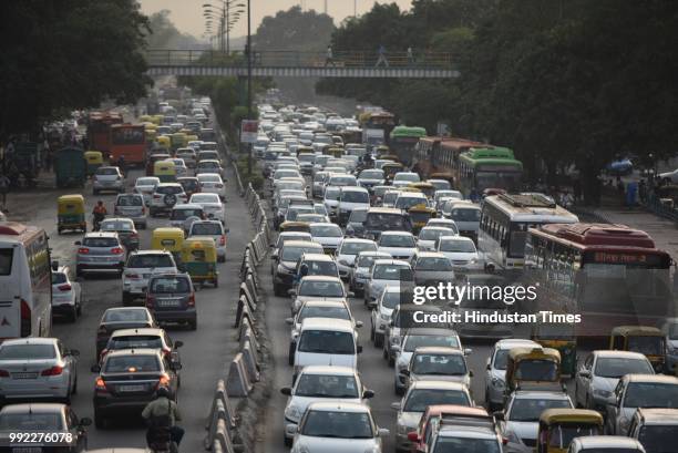 Traffic moves slow after heavy monsoon rains lashed the city, at South Extension, on July 5, 2018 in New Delhi, India.