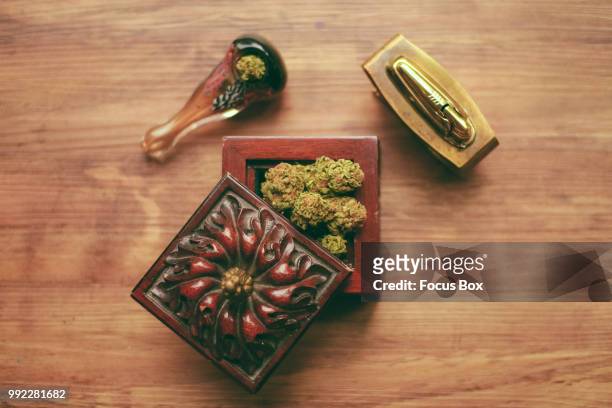 stash box - green lighter stock pictures, royalty-free photos & images