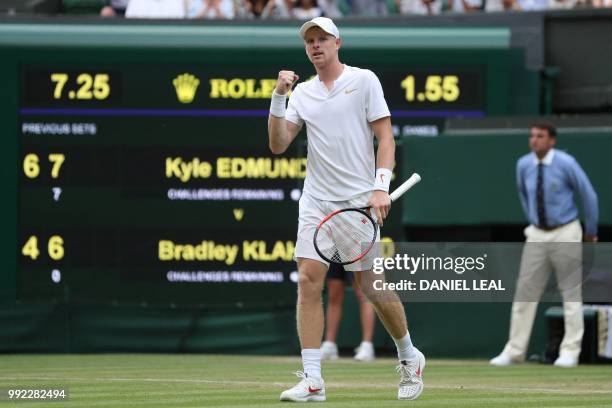 Britain's Kyle Edmund celebrates beating US player Bradley Klahn 6-4, 7-5, 6-2 in their men's singles second round match on the fourth day of the...