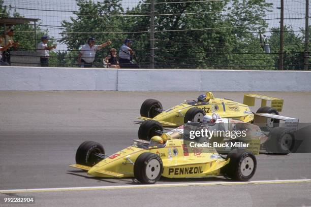 Indianapolis 500: Rick Mears in action, leading Penske teammates Danny Sullivan and Al Unser Sr. During race at Indianapolis Motor Speedway....