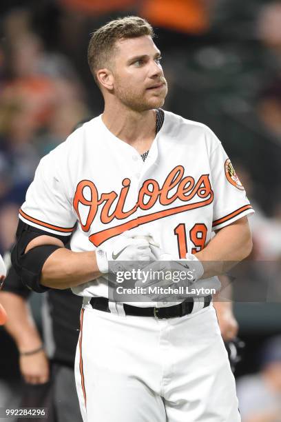 Chris Davis of the Baltimore Orioles looks on after striking out during a baseball game against the Seattle Mariners at Oriole Park at Camden Yards...