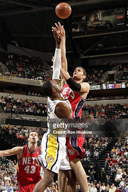 Brook Lopez of the New Jersey Nets goes up for a shot against Roy Hibbert of the Indiana Pacers during the game at Conseco Fieldhouse on April 10,...