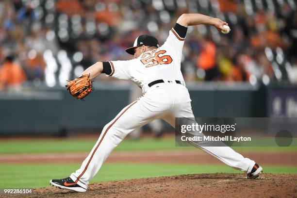 Darren O'Day of the Baltimore Orioles pitches during a baseball game against the Seattle Mariners at Oriole Park at Camden Yards on June 26, 2018 in...