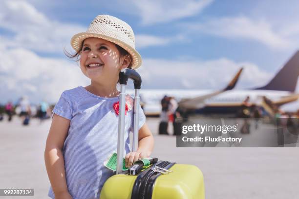 lovely toddler with a yellow coffer - travel excitement stock pictures, royalty-free photos & images