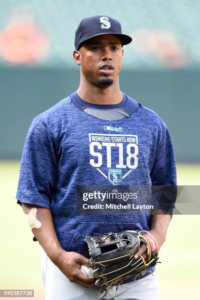 Jean Segura of the Seattle Mariners looks on during batting practice of a baseball game against the Baltimore Orioles at Oriole Park at Camden Yards...