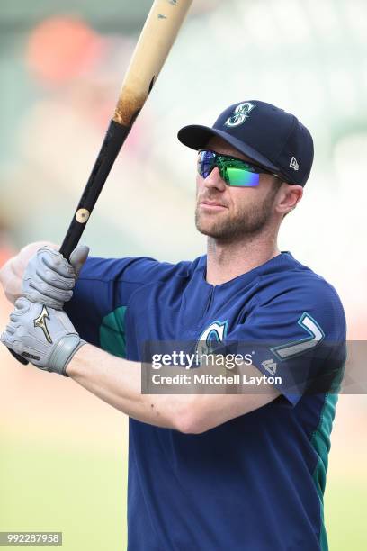 Andrew Romine of the Seattle Mariners looks on during batting practice of a baseball game against the Baltimore Orioles at Oriole Park at Camden...