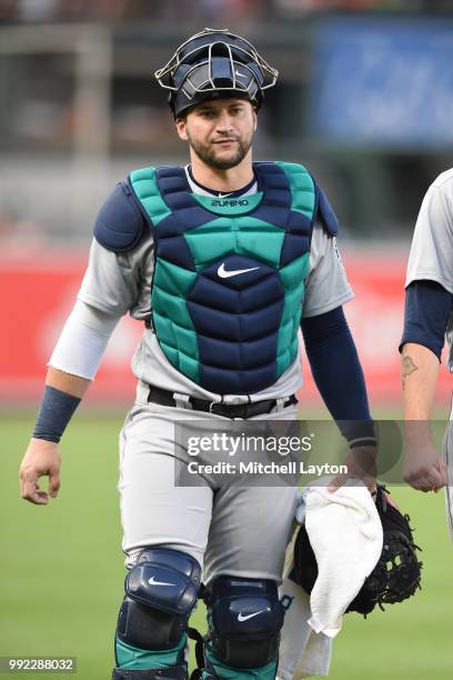 Mike Zunino of the Seattle Mariners walks to the dug out before a baseball game against the Baltimore Orioles at Oriole Park at Camden Yards on June...