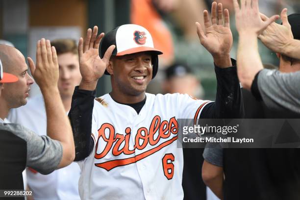 Jonathan Schoop of the Baltimore Orioles celebrates scoring a run during a baseball game against the Seattle Mariners at Oriole Park at Camden Yards...