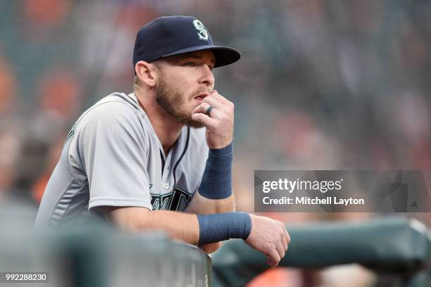 Chris Herrmann of the Seattle Mariners looks on from the dug out during a baseball game against the Baltimore Orioles at Oriole Park at Camden Yards...