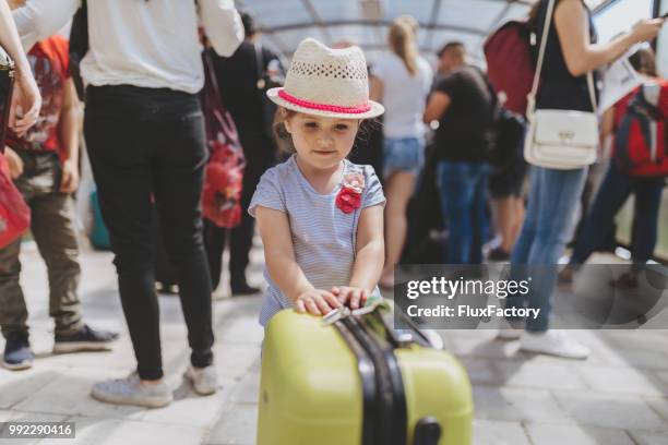 toddler girl waiting with her coffer - coffer stock pictures, royalty-free photos & images