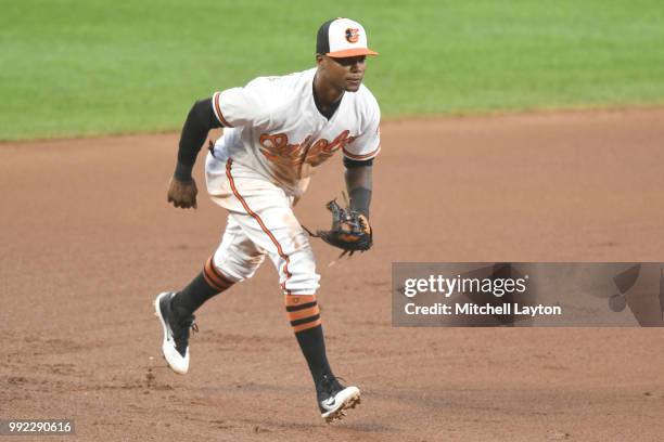 Tim Beckham of the Baltimore Orioles prepares to field a ground ball during a baseball game against the Seattle Mariners at Oriole Park at Camden...