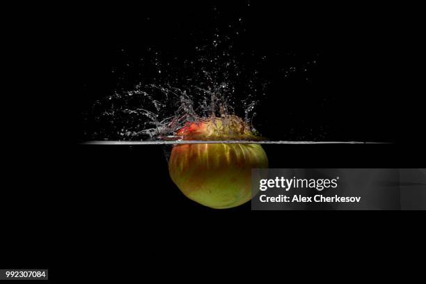 apple in water - splash crown stock pictures, royalty-free photos & images