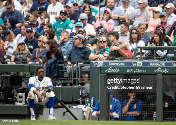 Dee Gordon of the Seattle Mariners watches play from the edge of the dugout during a game against the Kansas City Royals at Safeco Field on July 1,...