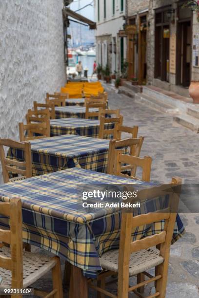 table and chairs (hydra, greece) - hydra bildbanksfoton och bilder