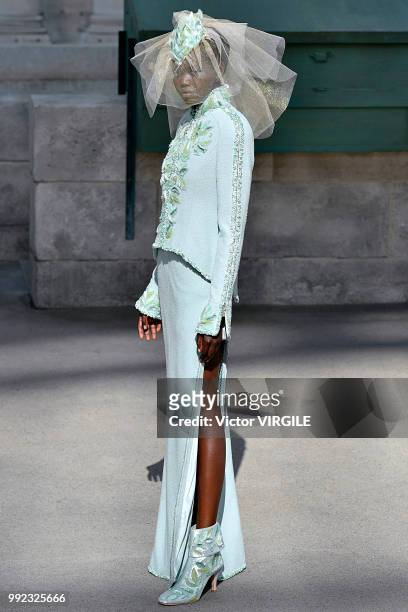 Adut Akech walks the runway during the Chanel Haute Couture Fall Winter 2018/2019 fashion show as part of Paris Fashion Week on July 3, 2018 in...