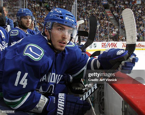 Alex Burrows of the Vancouver Canucks looks on from the bench in Game 6 of the Western Conference Semifinals against the Chicago Blackhawks during...