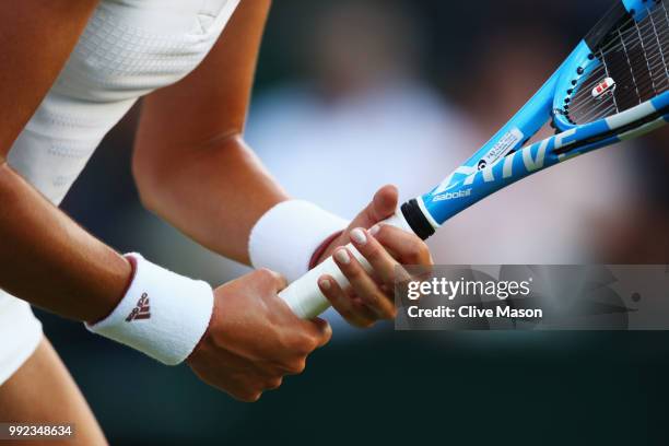 Detailed view of Garbine Muguruza of Spain preparing to return a shot against Alison Van Uytvanck of Belgium during their Ladies' Singles second...