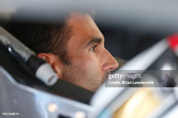 Aric Almirola, driver of the Smithfield Ford, sits in his car during practice for the NASCAR Xfinity Series Coca-Cola Firecracker 250 at Daytona...