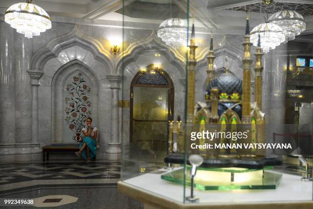 Woman waits inside the Qolsharif mosque in Kazan on July 5 on the eve of the Russia 2018 World Cup quarter final football match between Belgium and...