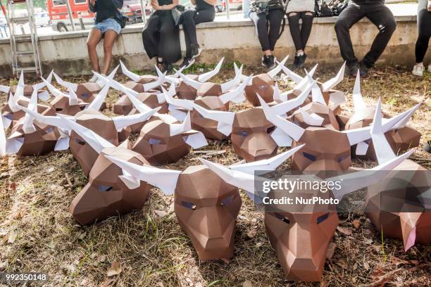 Paperboard bullhead mask during the preparations of a protest against the animal cruelty in bullfightings before the San Fermin celebrations in...