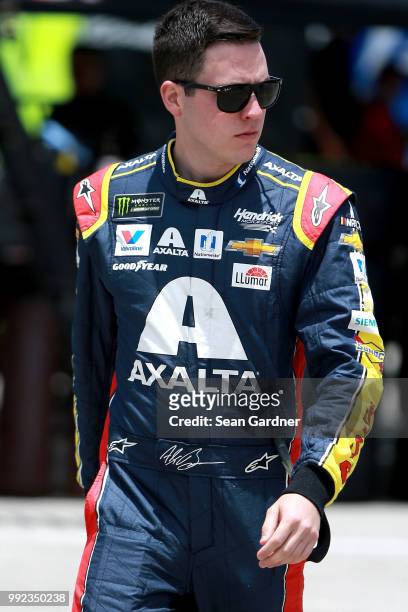 Alex Bowman, driver of the Axalta Chevrolet, walks to his car during practice for the Monster Energy NASCAR Cup Series Coke Zero Sugar 400 at Daytona...