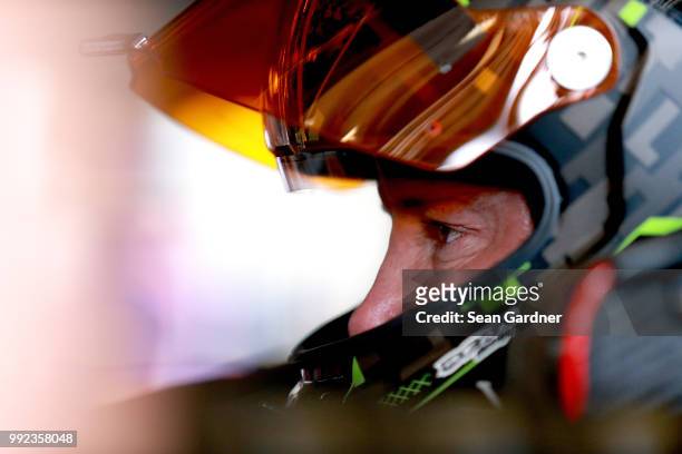 Kurt Busch, driver of the Monster Energy/Haas Automation Ford, sits in his car during practice for the Monster Energy NASCAR Cup Series Coke Zero...