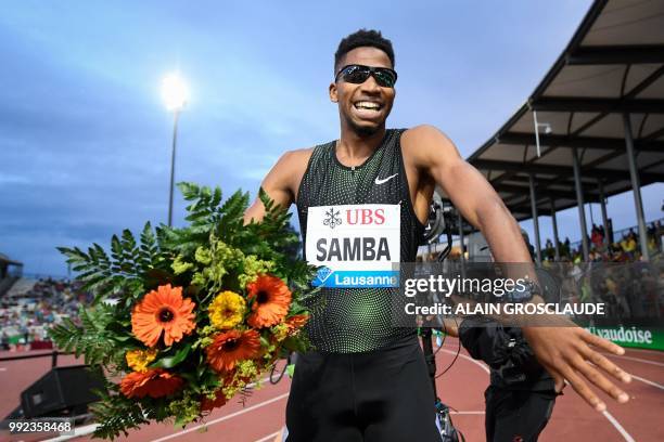 Qatar's Abderrahman Samba celebrates after winning the Men's 400m hurdles during the IAAF Diamond League athletics meeting Athletissima in Lausanne...