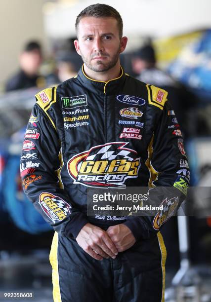 Matt DiBenedetto, driver of the Zynga Poker Ford, stands in the garage area during practice for the Monster Energy NASCAR Cup Series Coke Zero Sugar...