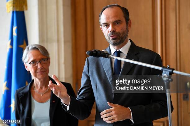 French Prime Minister Edouard Philippe speaks during a press conference, next to French Transports Minister Elisabeth Borne at the prefecture of...