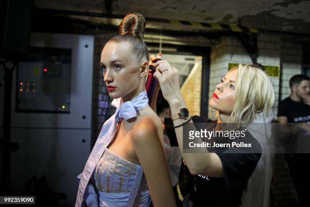 Models preparing backstage ahead of the I'Vr Isabel Vollrath show during the Berlin Fashion Week Spring/Summer 2019 at ewerk on July 5, 2018 in...