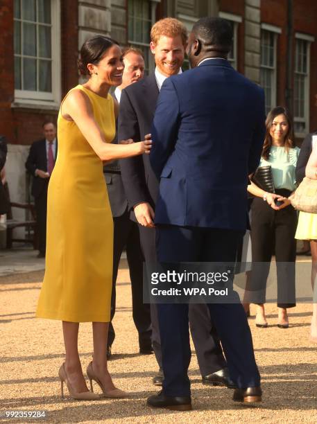 Prince Harry, Duke of Sussex and Meghan, Duchess of Sussex attend the Your Commonwealth Youth Challenge reception at Marlborough House on July 05,...