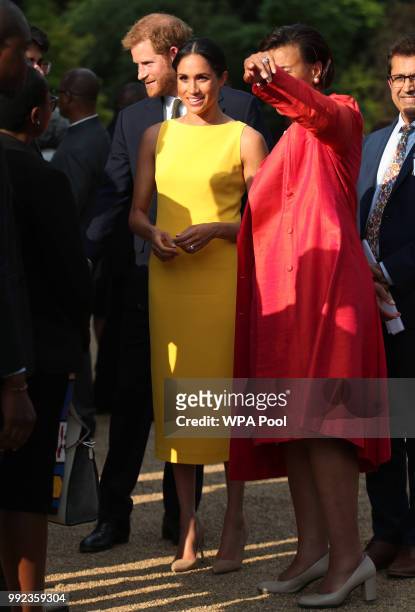 Prince Harry, Duke of Sussex and Meghan, Duchess of Sussex accompanied by Commonwealth secretary general Baroness Scotland attend the Your...