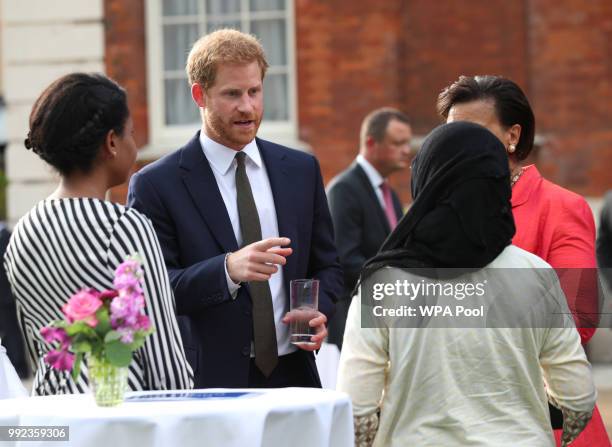 Prince Harry, Duke of Sussex meets guests during the Your Commonwealth Youth Challenge reception at Marlborough House on July 05, 2018 in London,...