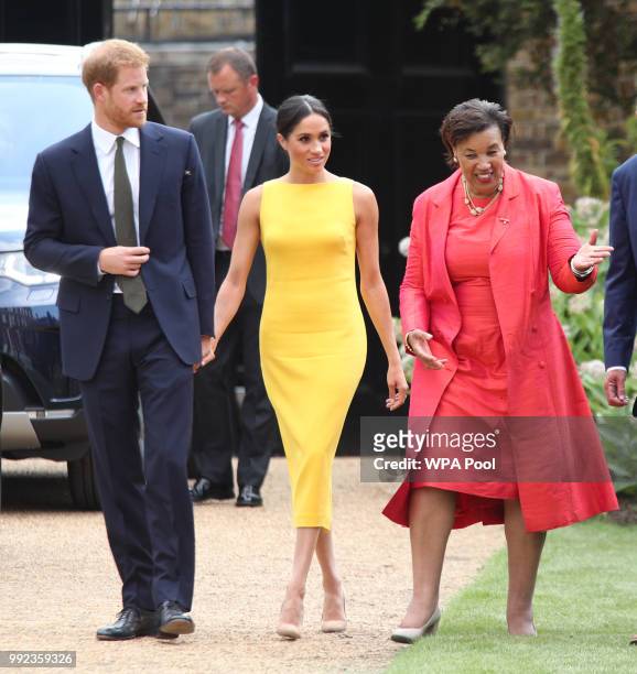 Prince Harry, Duke of Sussex and Meghan, Duchess of Sussex accompanied by Commonwealth secretary general Baroness Scotland arrive to attend the Your...