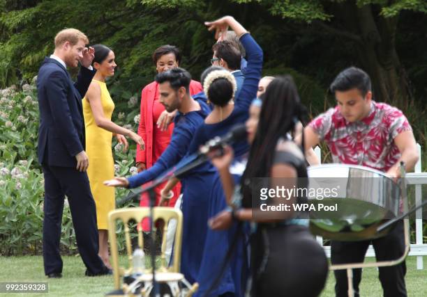 Prince Harry, Duke of Sussex and Meghan, Duchess of Sussex accompanied by Commonwealth secretary general Baroness Scotland attend the Your...