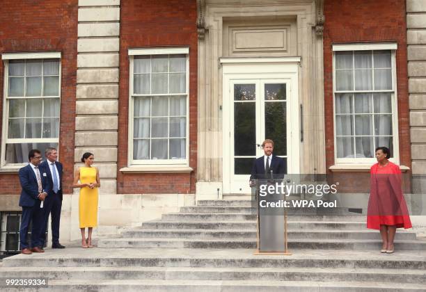 Prince Harry, Duke of Sussex makes a speech watched by Meghan, Duchess of Sussex and Commonwealth secretary general Baroness Scotland during the Your...