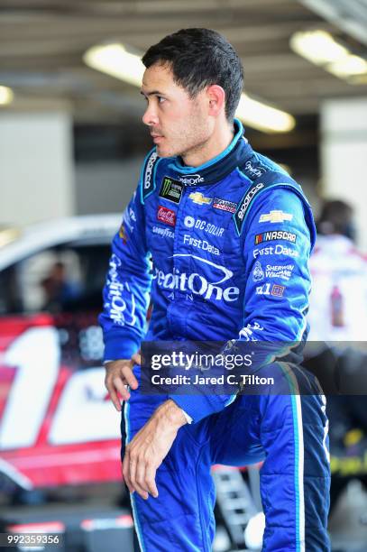 Kyle Larson, driver of the Credit One Bank Chevrolet, stands by his car during practice for the Monster Energy NASCAR Cup Series Coke Zero Sugar 400...