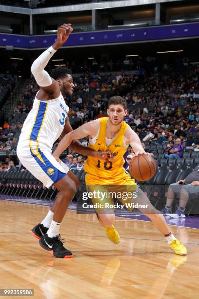 Svi Mykhailiuk of the Los Angeles Lakers drives to the basket against the Golden State Warriors during the 2018 Summer League at the Golden 1 Center...