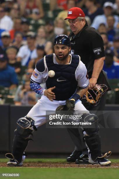 Milwaukee Brewers catcher Manny Pina blocks a ball during a game between the Milwaukee Brewers and the Minnesota Twins at Miller Park on July 4, 2018...